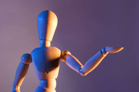 An artist's mannequin posed in funny or odd positions.の写真素材