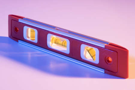 Level on white seamless with orange and blue lightingの写真素材