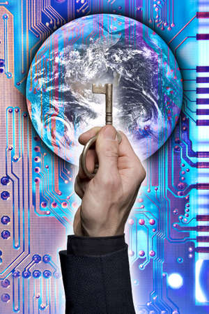 Composite of a hand holding a key with image of earth and a circuit board.の写真素材