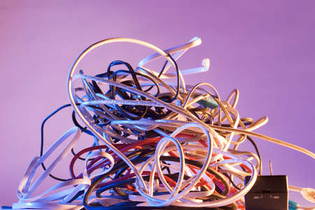 Pile of tangled cordsの写真素材