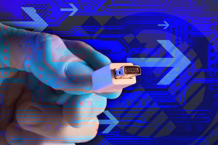 Hand holding a computer plugの写真素材