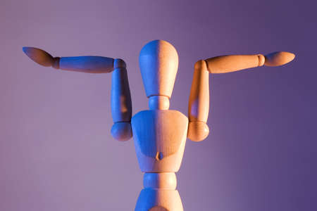 artist's mannequin posed in an odd positionの写真素材