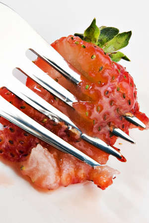 Smashing strawberriesの写真素材