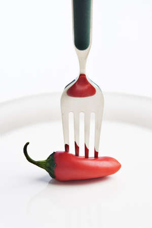 Pepper stuck by a fork の写真素材