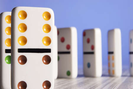 Dominos placed on a stock report representing business concepts. の写真素材