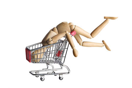 Mannequin doing a headstand in a shopping cartの写真素材