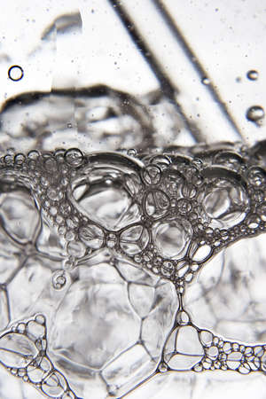 Blowing bubbles into a glass of water