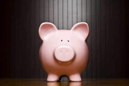 Piggy bank on a tableの写真素材