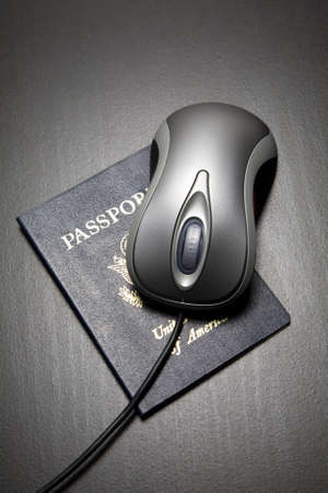 Computer mouse on passportの写真素材