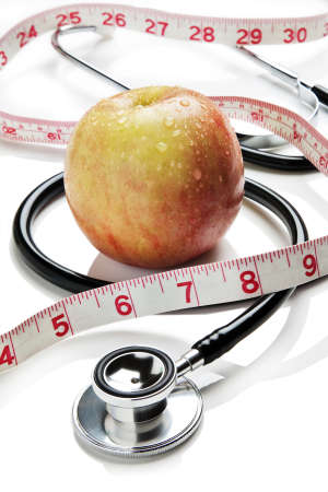 Apple, tape measure and stethoscope の写真素材