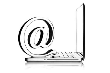 At symbol paper weight with laptop computer の写真素材