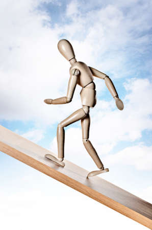 Manikin, anatomical model, posed to appear to be running up a hillの写真素材