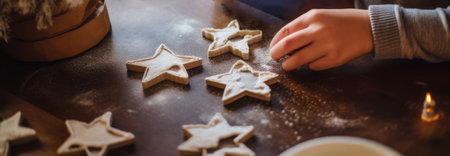 hand making Christmas cookies icing sugar wooden table festive atmosphere baking beakery High resolution AI generatedの素材