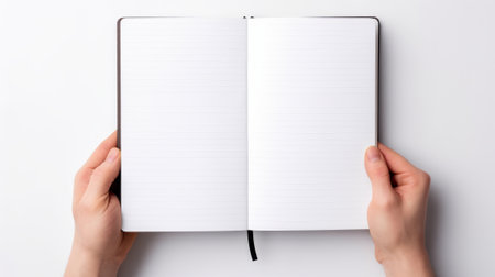 two hands holding an open notebook with blank lined pages, against a white background Ai generatedの素材