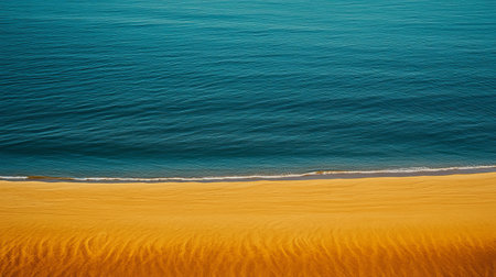 Experience a stunning coastal scene where golden sand dunes gracefully meet the deep blue sea, creating a tranquil and picturesque landscape ideal for relaxation and escape.の素材