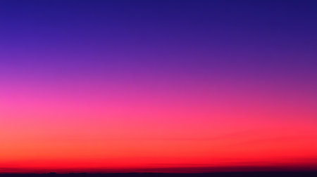Experience a breathtaking sunset with a vibrant gradient of red, orange, and purple hues over a serene horizon, perfect for inspiration and relaxation.の素材