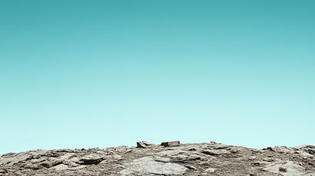 This image captures cacti growing on rocky terrain in the desert, showcasing nature's resilience under a clear blue sky. Perfect for themes of wilderness and ecology.の素材