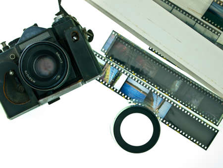 Old camera with slide film and magnifying loop