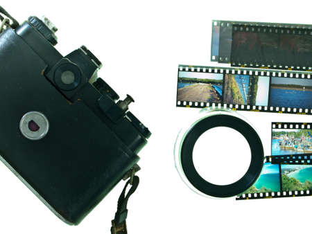 Old camera with slide film and magnifying loopの写真素材