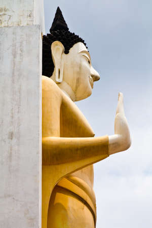 Side of yellow Buddha's statue in Thailandの写真素材
