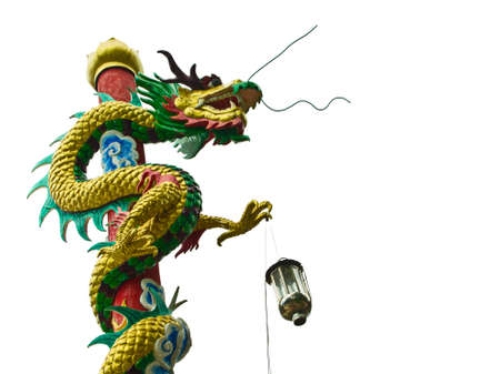 Dragon's statue on the pillar isolated on whiteの写真素材