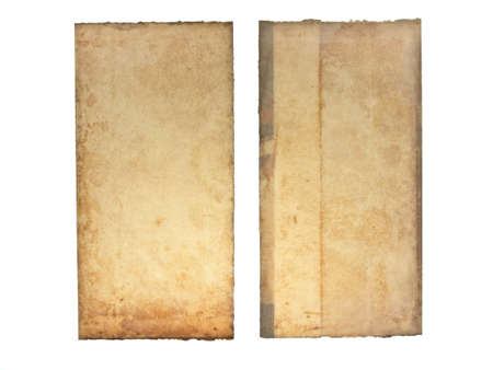 Two pieces of torn and yellowed book's cover paperの写真素材