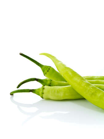 Long green chili on white backgroundの写真素材
