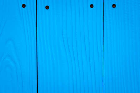 Blue gypsum panel with rusty nailの写真素材