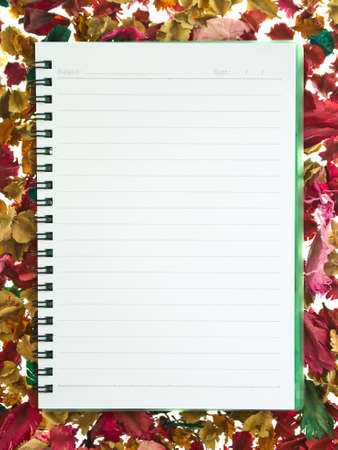 Spiral notebook on mixture of dry floralの写真素材
