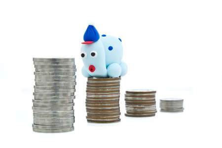 Heap of coins and plasticine turtle for financial planning conceptの写真素材