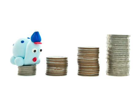 Heap of coins and plasticine turtle for financial planning conceptの写真素材