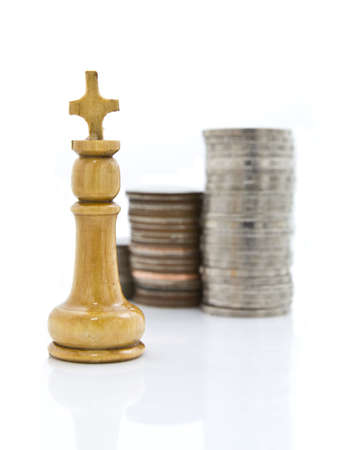 Queen chess and heaps of coins for financial conceptの写真素材