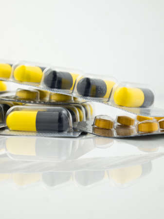Packs of pills on white table