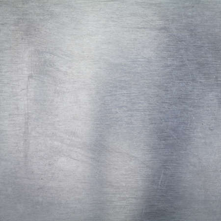 Old and scratched aluminium materialの写真素材