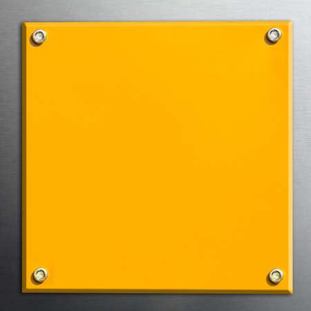 Yellow steel plate on aluminium backgroundの写真素材