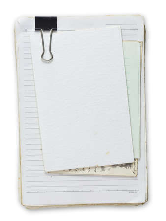 Old notepad with postcard and  papersの写真素材