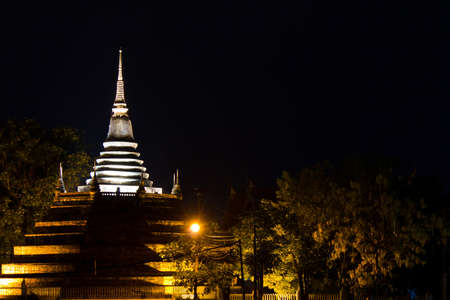Ancient pagoda at night   Wat Rajaburana, landmark in Phitsanulok, Thailand の写真素材