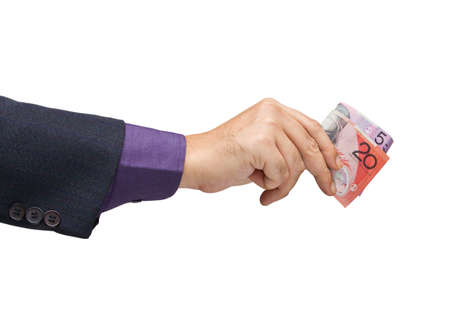 Businessman stretch his arm to give moneyの写真素材