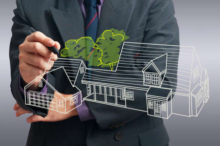 Architect drawing house on screenの写真素材