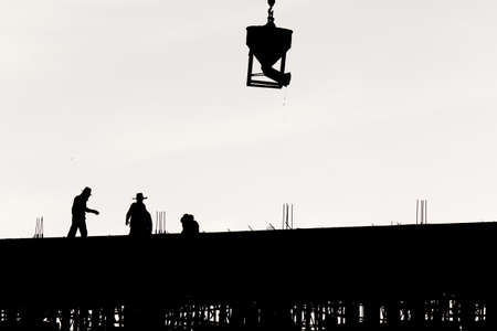 Silhouette worker at construction siteの写真素材