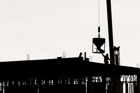 Silhouette worker at construction site