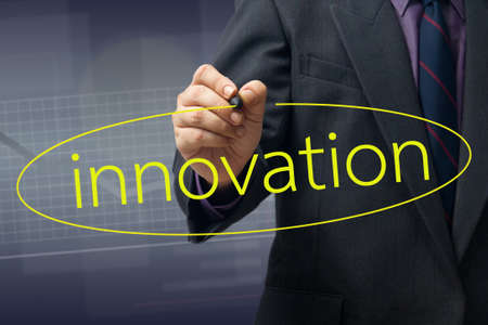 Businessman draw a circle on Innovation wordの写真素材