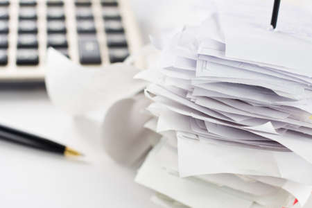 Bills in paper nail on business deskの写真素材