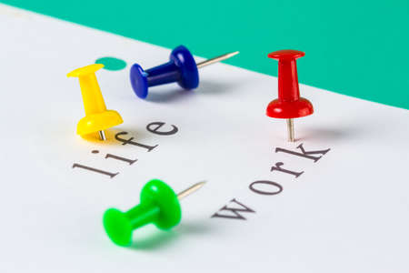 Push pin on paper for life and work balance conceptの写真素材