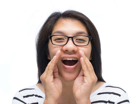 Asian woman cover her mouth and whisperingの写真素材