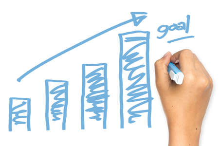 Hand drawing graph on whiteboard