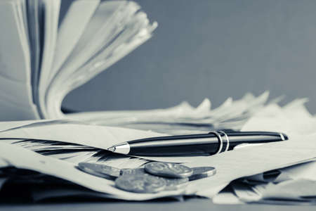 Pen on many receipts for accountancy conceptの写真素材