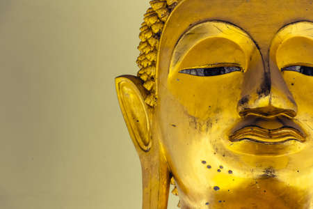 Closeup dirty Buddha face statueの写真素材
