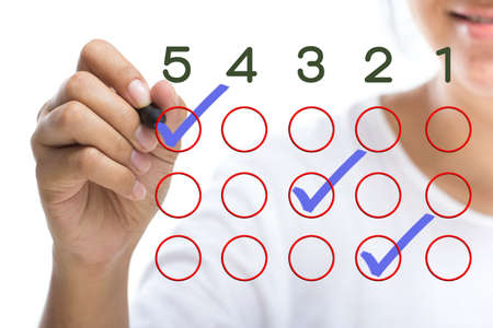 Closeup woman hand answer the questionnaire on screen