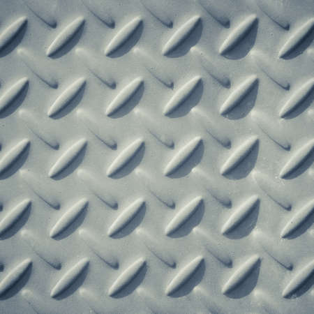 Checker plate metal in monotone colorの写真素材